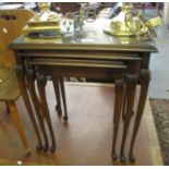 Nest of three modern mahogany finish table with glass inserts. (B.P. 21% + VAT)