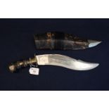 Large Kukri knife with turned handle and brass and plated mounts in leather scabbard. (B.P. 21% +