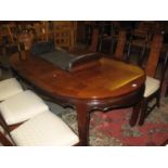 A large modern Chinese hardwood extending dining table with additional leaf, together with a set