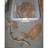 plastic box containing vintage ice skate with leather straps , pair of horse hobble irons, horse