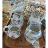 Tray of six 19th century pottery jugs to include Llanelly Colandine jug, figural lustre jugs,