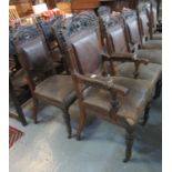 Set of nine early 20th Century oak dining chairs, carved with grotesque bird heads with leather