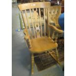 Modern beech slat back rocking armchair with heart decoration. (B.P. 21% + VAT)