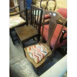 Low lyre backed nursing chair with tapestry seat and a late 18th century Welsh oak stick back dining