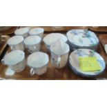 18-piece Melba bone china part-tea set on a white ground with Oriental landscape with sun and trees,