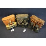 Three pairs of binoculars to include early 20th century brass mounted in later pig skin case, and