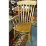 Traditional beech slat backed kitchen rocking elbow chair. (B.P. 21% + VAT)