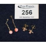 9 ct daffodil design Clogau Gold earrings and a pair of coral bead earrings. 2.9g total approx. (B.