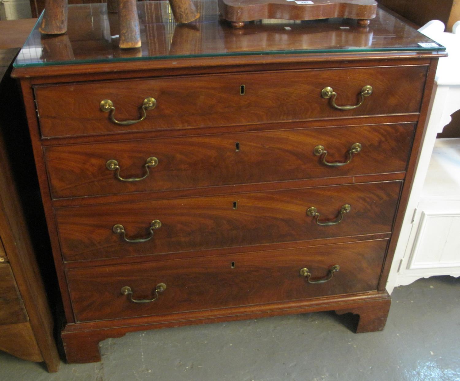 19th Century style mahogany straight front chest of four long drawers on a projecting base with