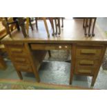 Early 20th century oak s caven leather top with three drawers to each pedestal on square legs. (B.P.