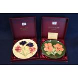 Two Moorcroft art pottery tube lined cabinet plates in original boxes to include Moorcroft year