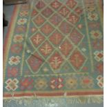 Early 20th century multi-coloured kelim rug with stylized foliate and lozenge decoration . 134 x 180