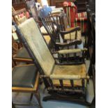 Early 20th century American spring rocking arm chair in distressed condition, together with a