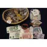 Small wicker basket containing a large collection of varied, mainly British coins, a toffee hammer