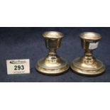 Pair of silver plain beaded design dwarf candlesticks with loaded bases. Birmingham hallmarks. (