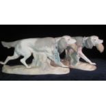 Pair of Lladro Spanish porcelain retriever dogs on naturalistic base with their catch. (2) (B.P. 21%