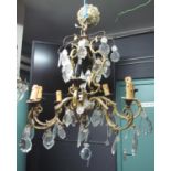 Gilt metal eight-branch chandelier light fitting overall with crystal droppers. (B.P. 21% + VAT)