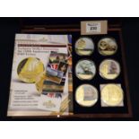 Cased set of Windsor mint gold plated commemorative coins honouring the 250th Anniversary of HMS