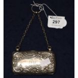 Small silver repousse rectangular shaped ladies purse with foliate and c scroll decoration,