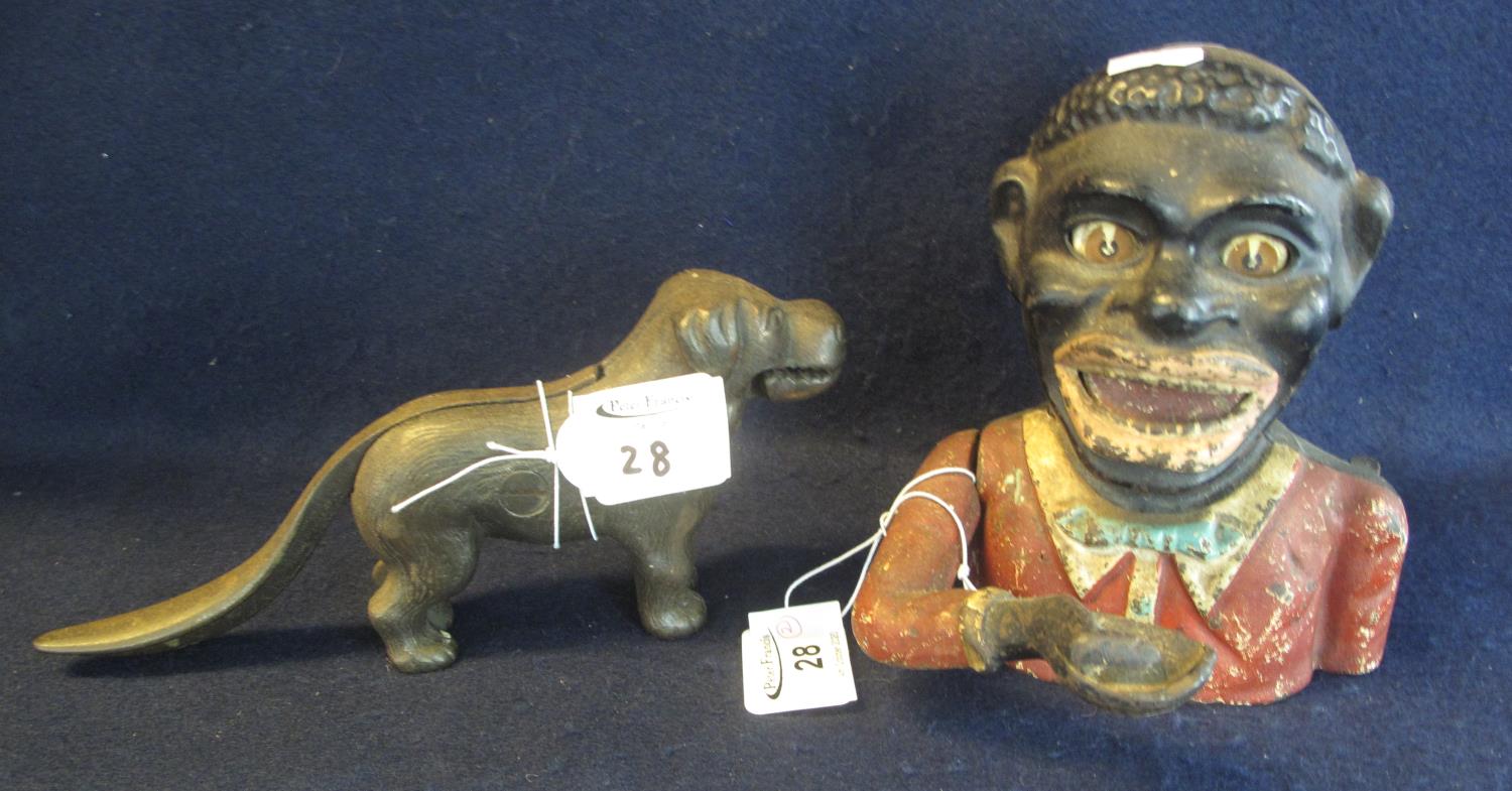 Cast metal novelty nutcracker in the form of a standing dog, together with a cast metal jolly