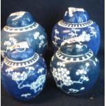 Two pairs of Chinese porcelain baluster shaped ginger jars and covers, all decorated with prunus