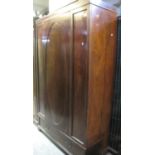 Edwardian inlaid mahogany wardrobe with blind panel door and foliate decoration over under