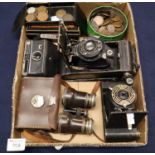 Tray of assorted cameras, including two folding cameras, an Instamatic camera, pair of vintage opera