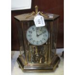 Brass 100 day perpetual motion mantel clock. (B.P. 21% + VAT)
