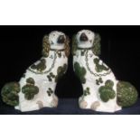 Pair of early 20th Century Staffordshire seated fireside dogs with painted features. (2) (B.P. 21% +