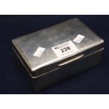 Plain silver cigarette box with dome hinged cover and wooden lining, London hallmarks. 13.5cm across