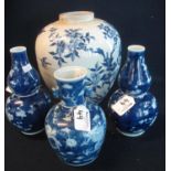 Pair of Chinese double gourd shaped blue and white baluster vases, overall decorated with prunus