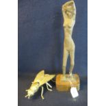 Clay study of a nude woman on wooden base after Frink, height 37cm approx. Together with a brass