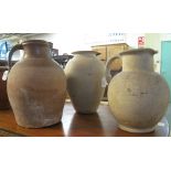 Two similar Welsh terracotta dairy pans, together with stoneware baluster jugs and a pottery jug