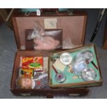 Vintage Pioneer luggage suitcase, the interior comprising a smaller suitcase, child's doll,