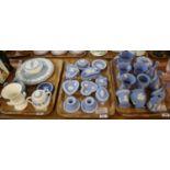 Three trays of Wedgwood mainly blue and white Jasperware items to include; candlesticks, trinket