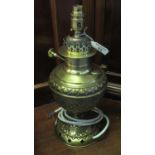 Brass oil lamp now converted to electricity, repousse hob nail decorated. (B.P. 21% + VAT)