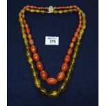 Two strings of amber coloured beads. (B.P. 21% + VAT)