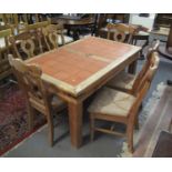 Modern pine kitchen table inset to the top with tiles, together with a set of six pine kitchen