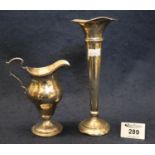 Silver trumpet shaped specimen vase and a silver Georgian style pedestal cream jug with gadroon