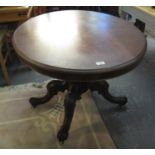 Victorian mahogany centre table of oval form on quatreform base. (B.P. 21% + VAT)