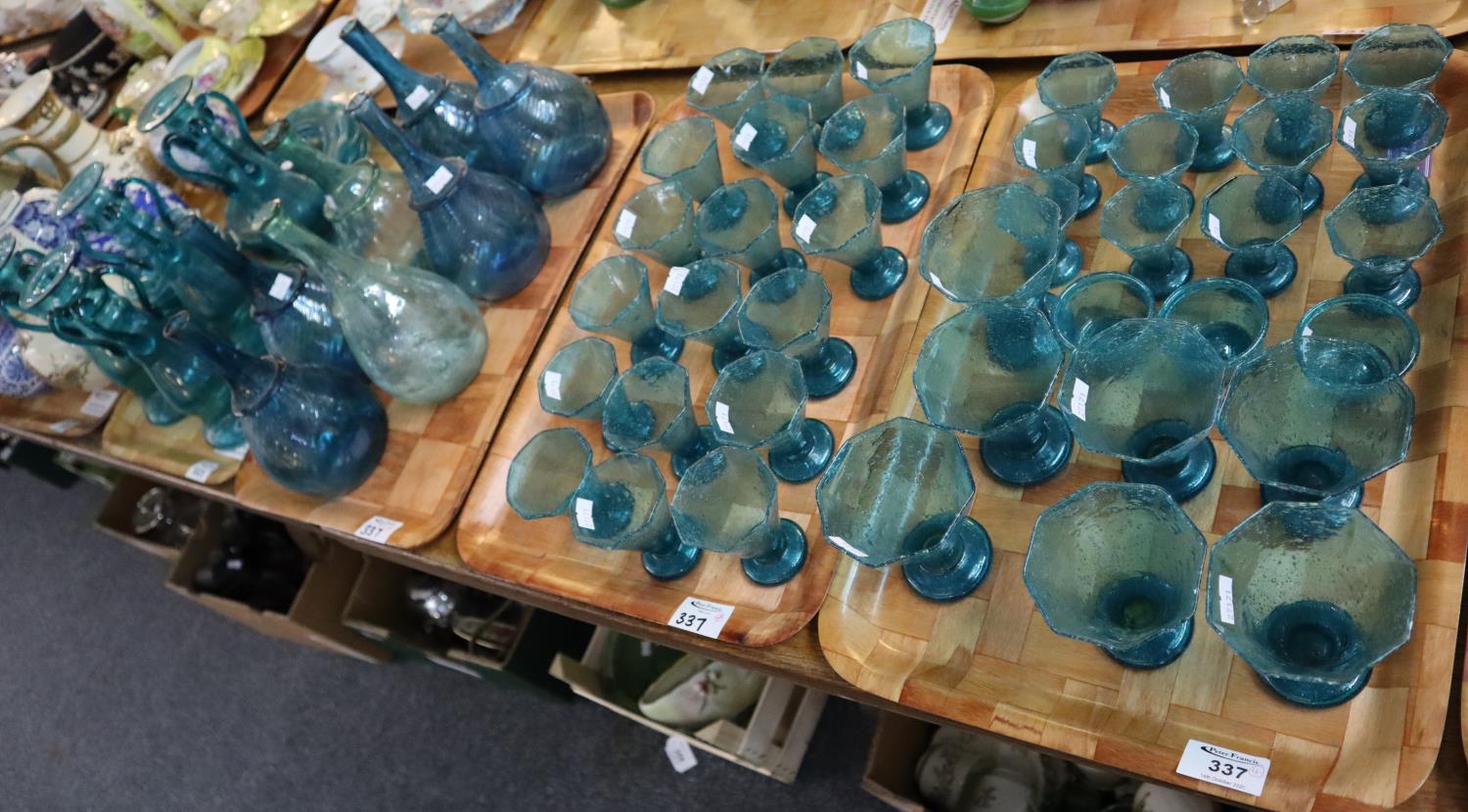 Four trays of assorted blue soda glass items to include; conical drinking glasses, flask shaped