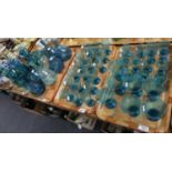 Four trays of assorted blue soda glass items to include; conical drinking glasses, flask shaped