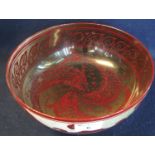 Bernard Moore flambe bowl of circular form decorated internally with stylised fish, painted marks to