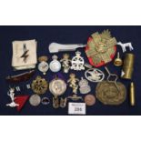 Small plastic box of assorted military insignia, enamel badges, cartridge etc. (B.P. 21% + VAT)