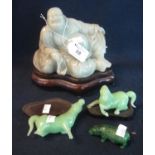 Chinese carved jade figure of a reclining smiling Buddha, together with two carved jade horses and a