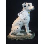 Modern pottery study of a seated dalmation on naturalistic base. (B.P. 21% + VAT)