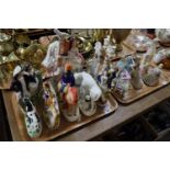 Two trays of Staffordshire flat backed figurines and figure groups, together with a collection of