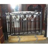 Modern black enamel Victorian style double bedsteads with side rails and slats, together with