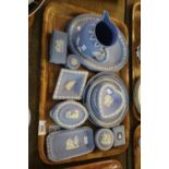 Tray of Wedgwood blue and white Jasperware items to include; trinket boxes, pin dishes, baluster jug