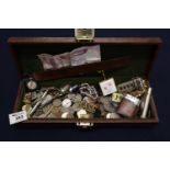 A jewellery case containing various foreign coins, cigarette lighters, key fobs etc. (B.P. 21% +